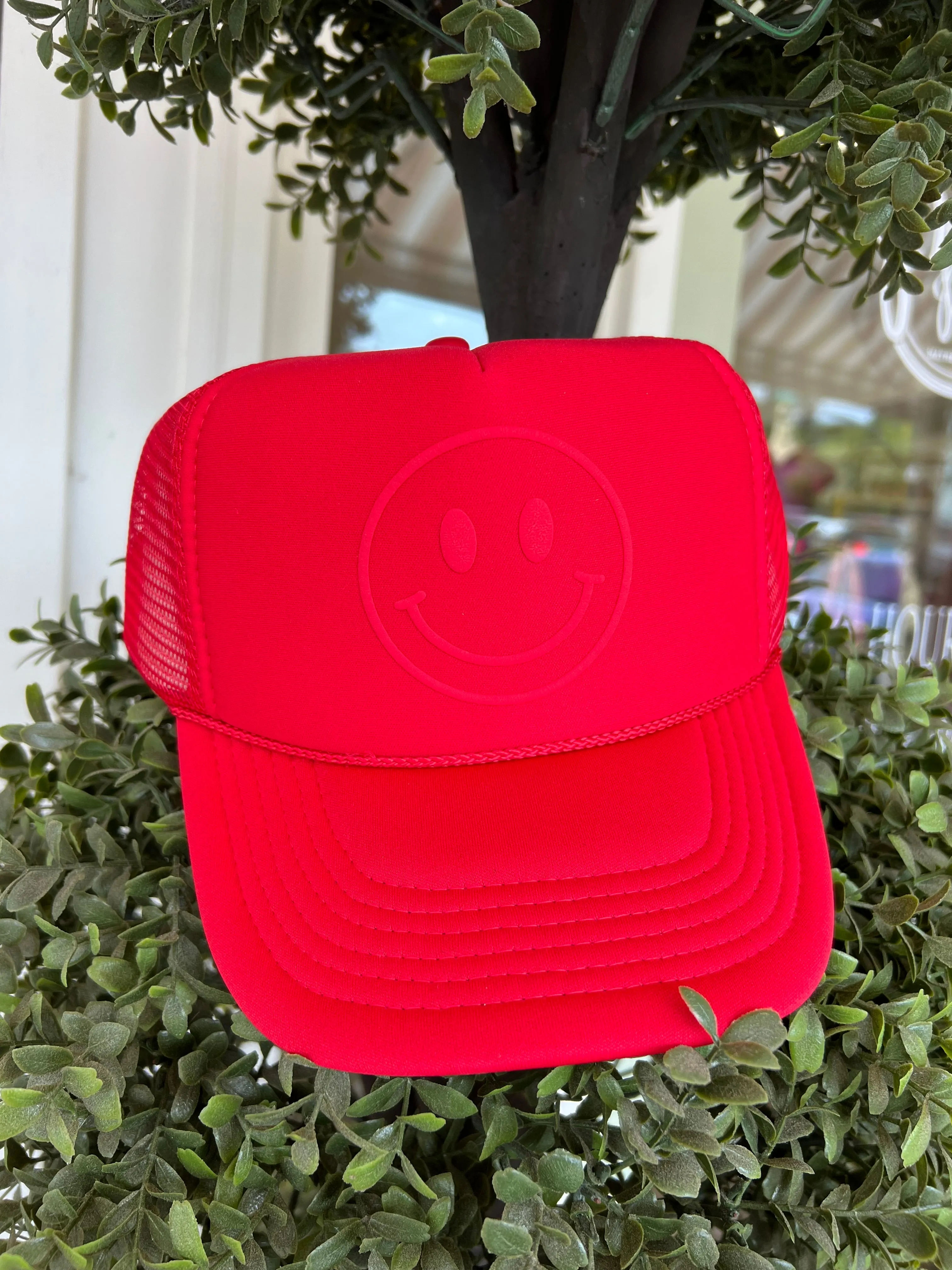 Happy Face Monochrome Trucker Hat in Red