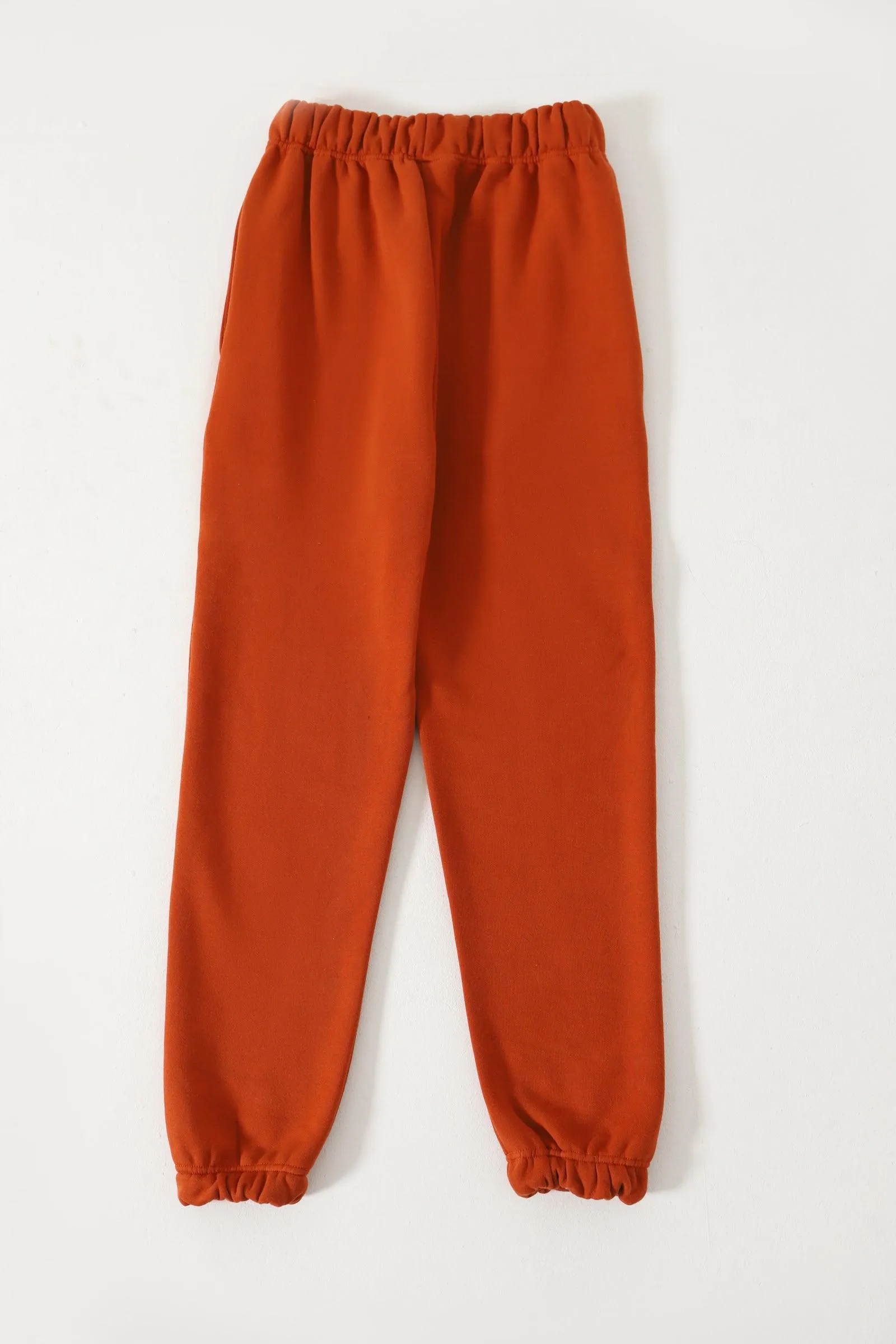 "ENLIGHTENMENT" RUST SWEATPANTS